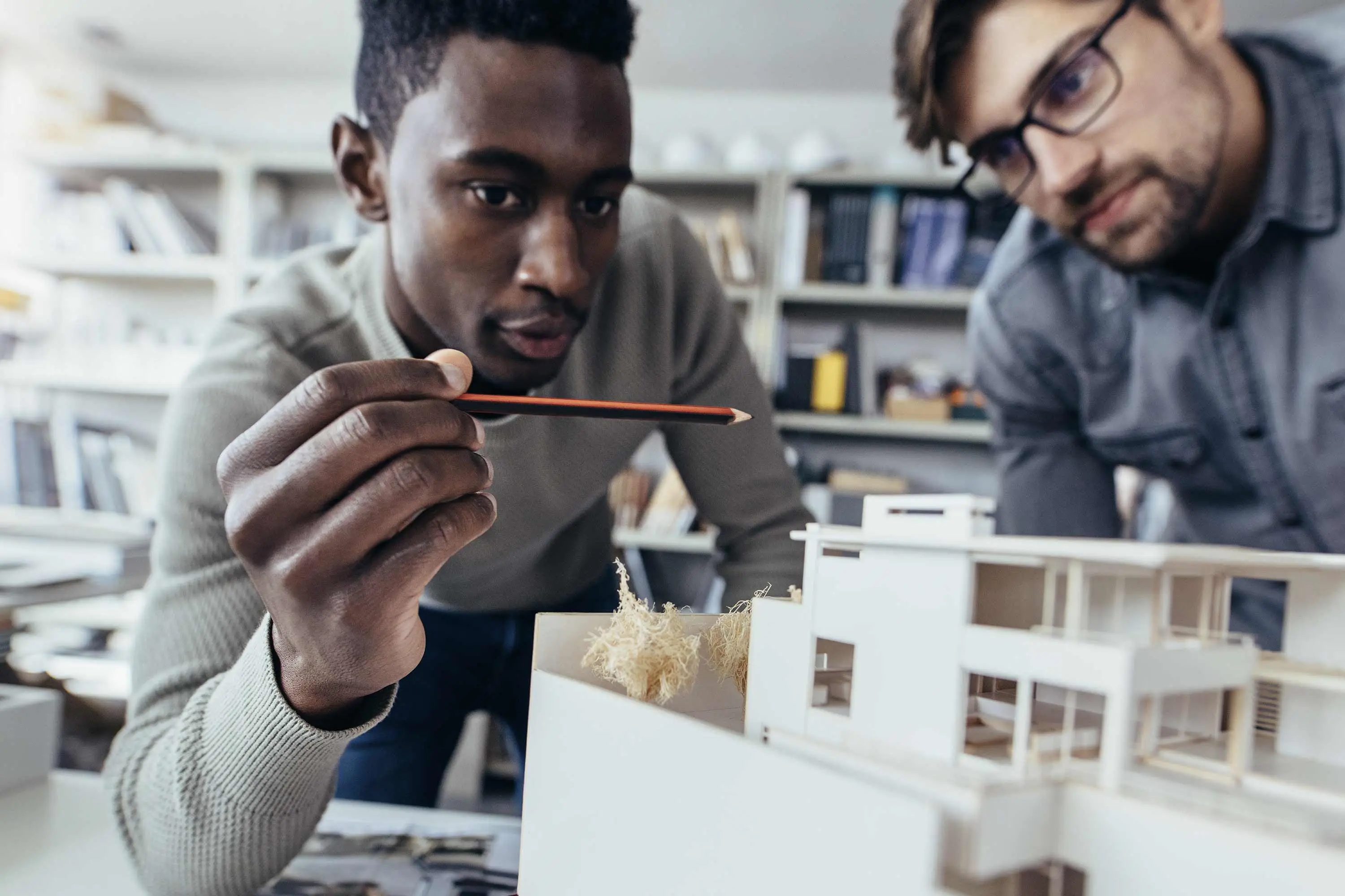 Two men looking at a buidling design