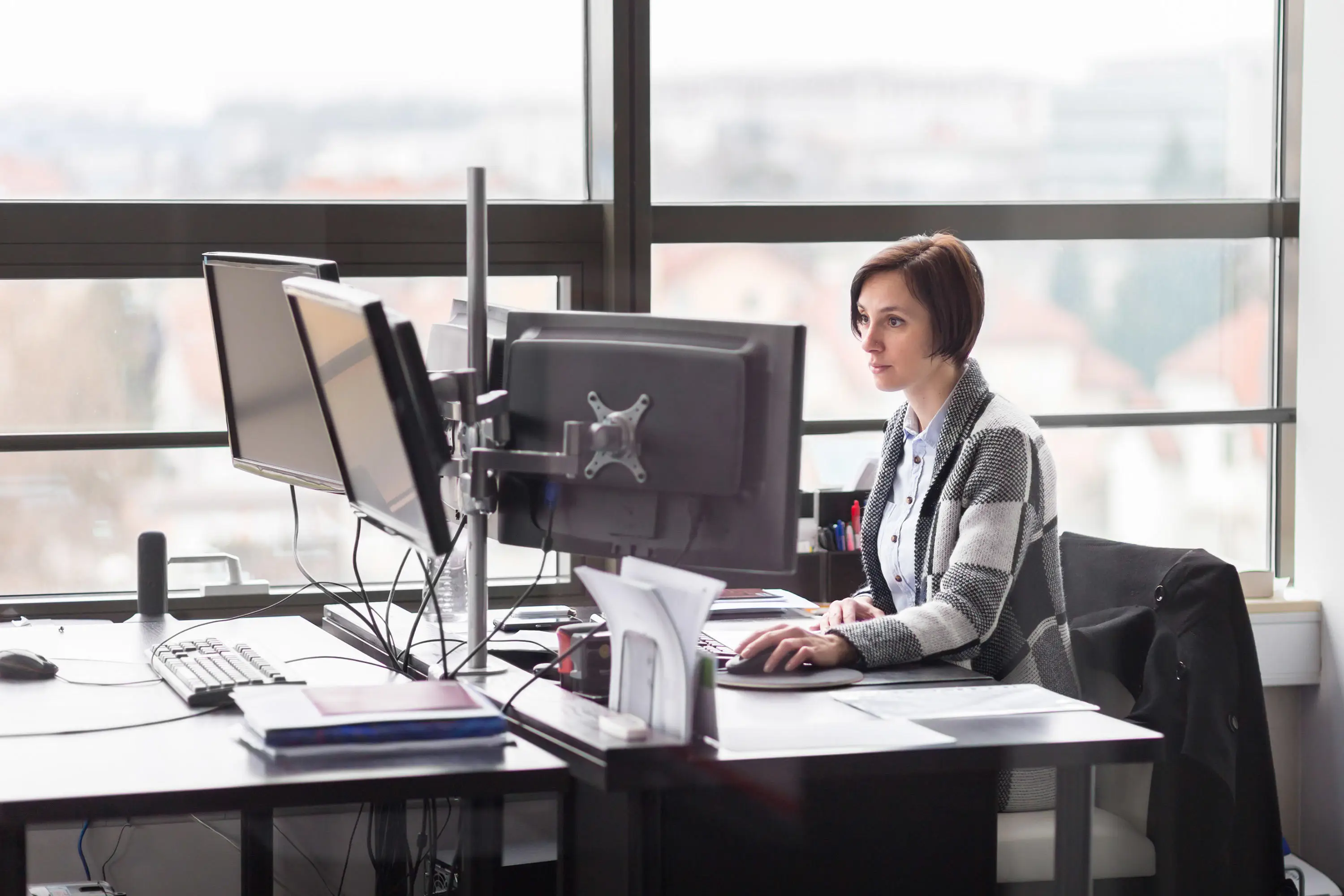 Women in an office looking at a computer screen