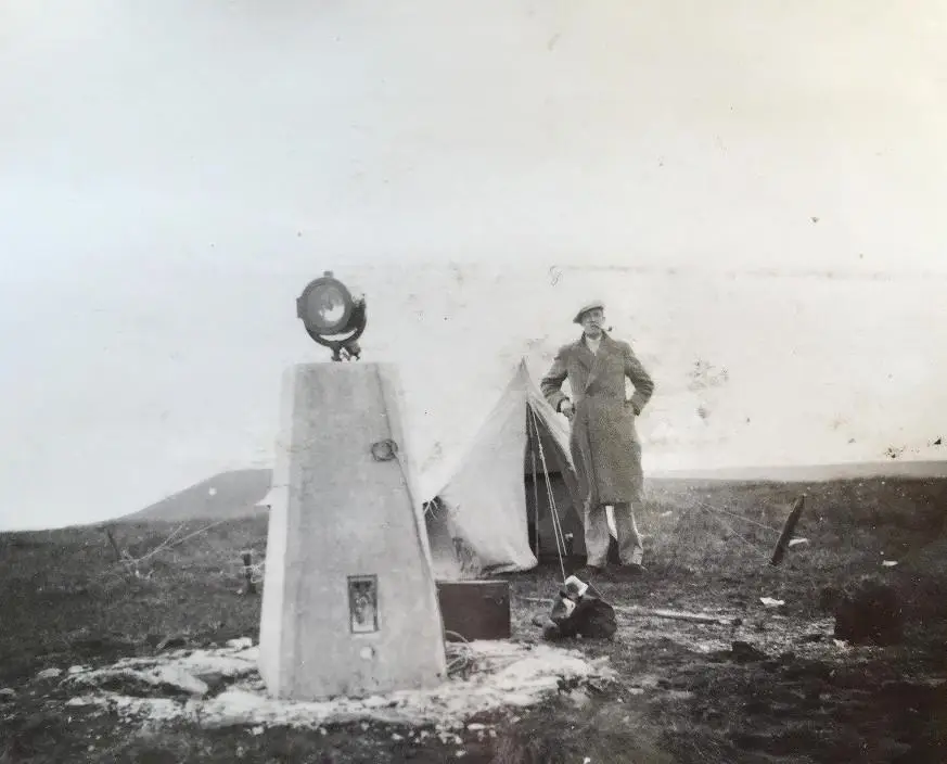 The type of beacons used and the surveyor’s tent for protection through the night