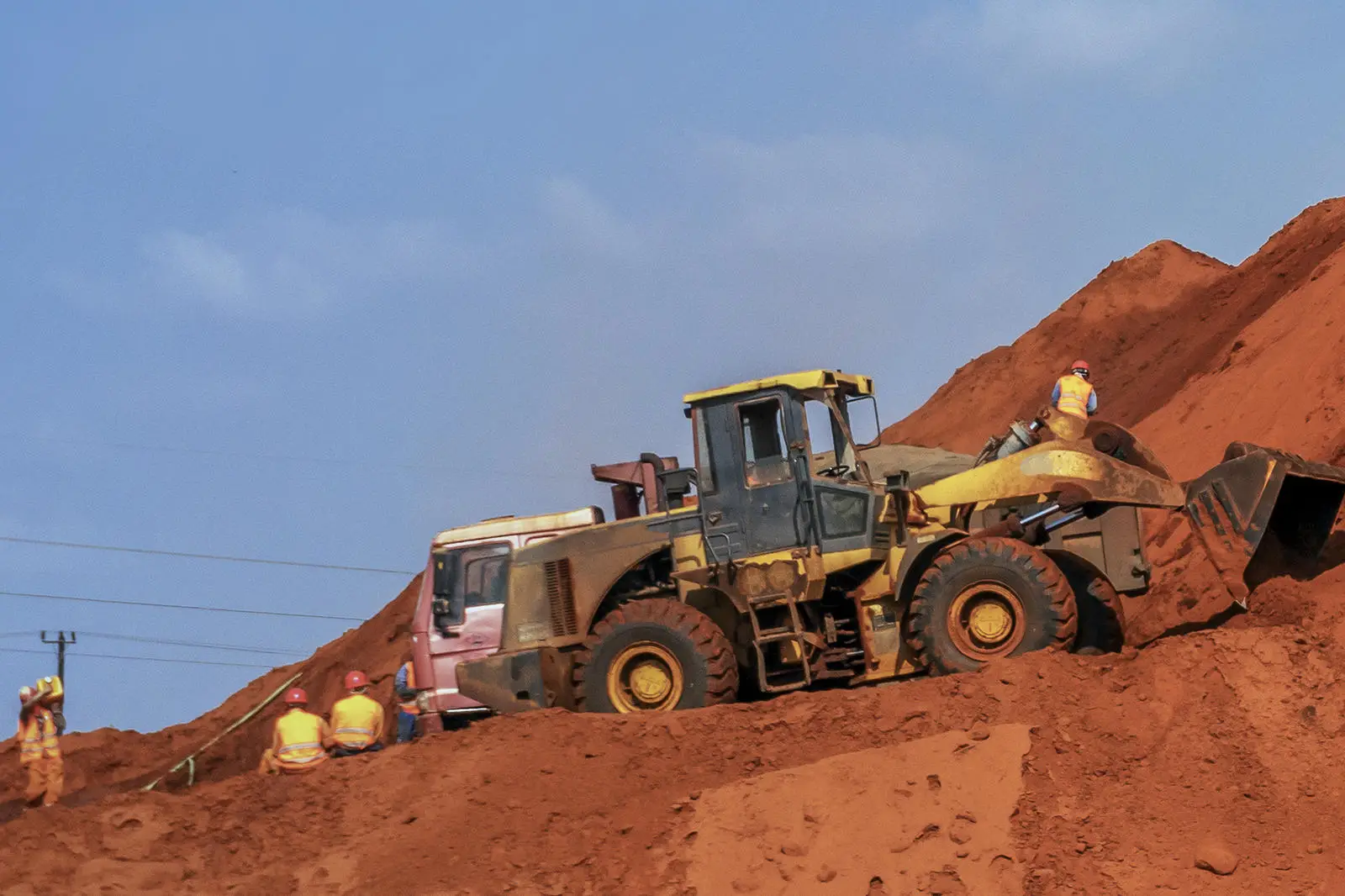 Construction crew on a clay hill
