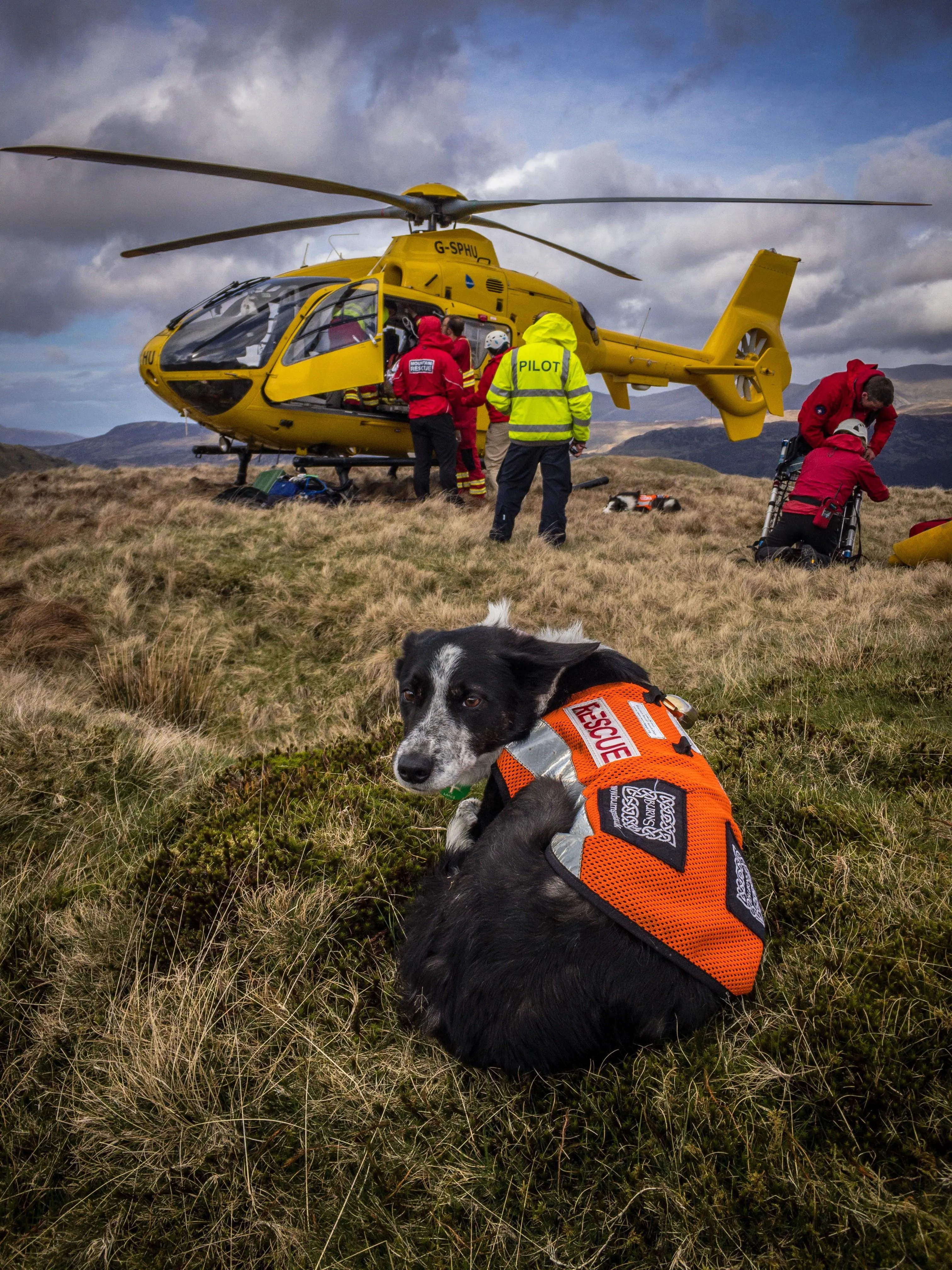 A mountain rescue helicopter has arrived on the scene of an emergency.