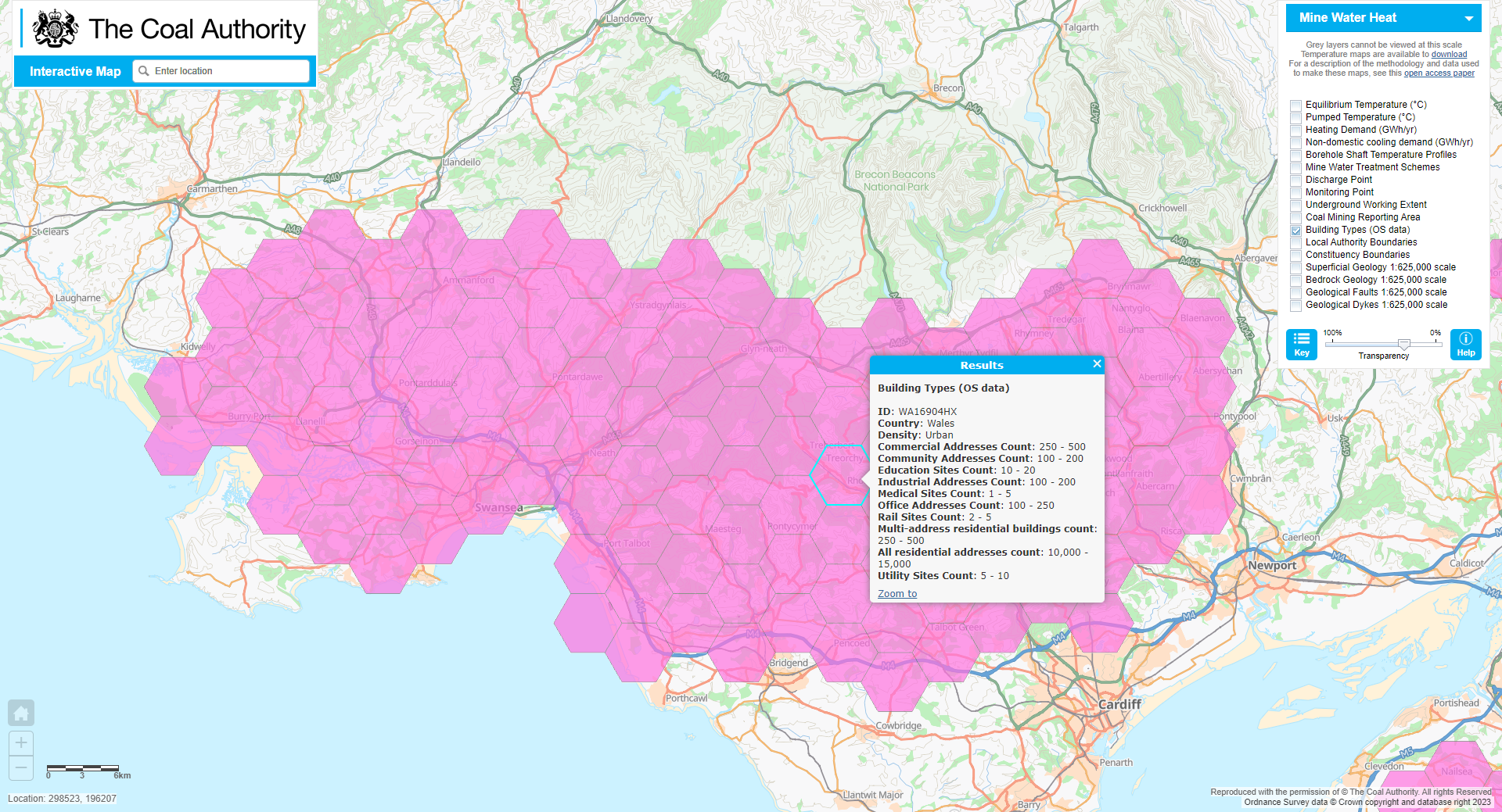 A map display showing building types in Wales over recorded abandoned coal mine workings, highlighted in pink..