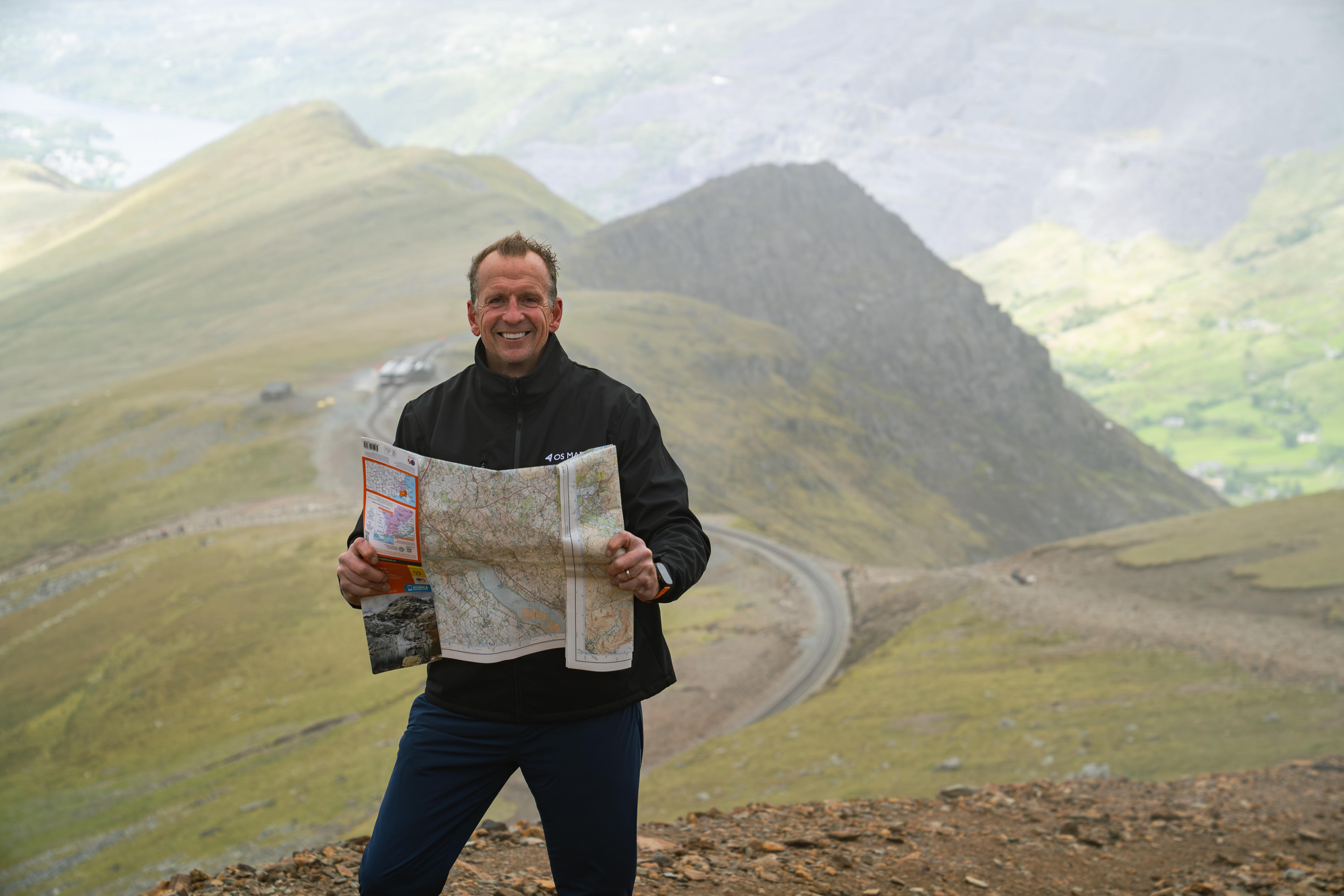 Professor Greg Whyte beside Snowdon Mountain Railway.