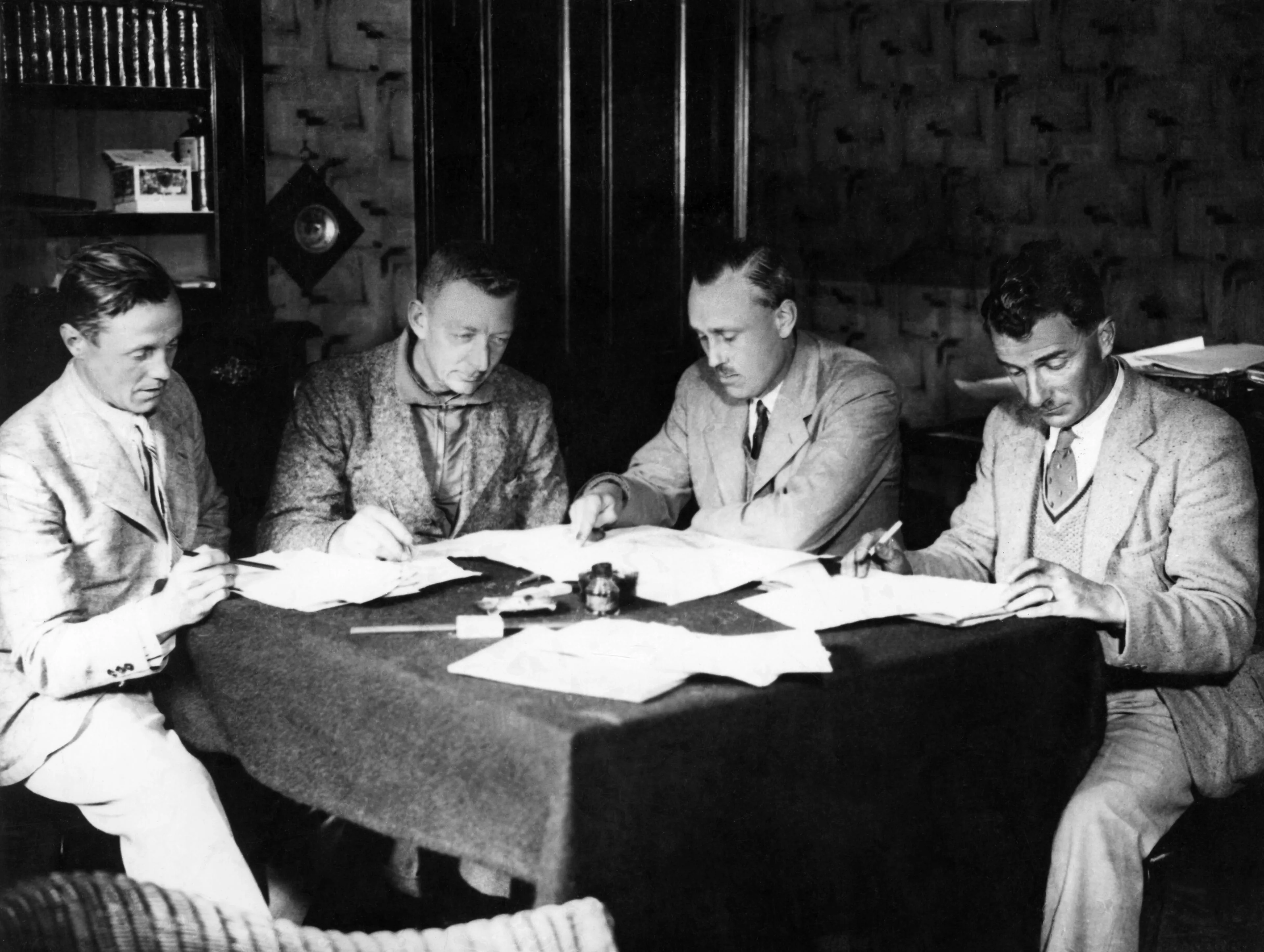 Photo of Hotine and his associates, planning the retriangulation