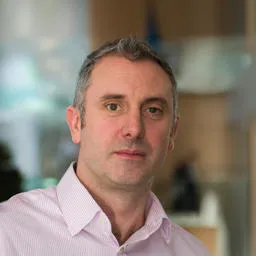 Headshot of Nick Giles OBE
